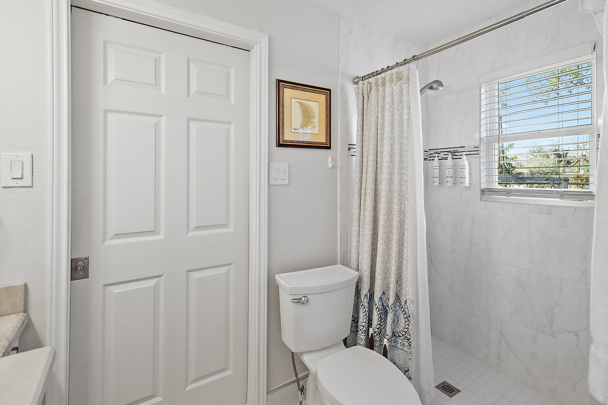 7317 Longview Street Houston, TX 77020 - Photo 16 of 30 a white toilet sitting next to a bathroom sink
