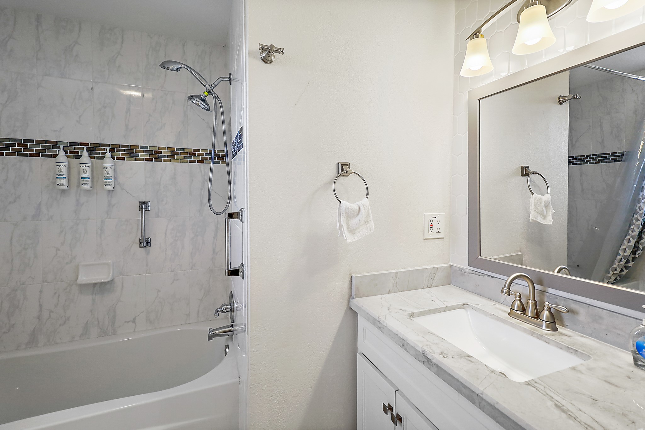 7317 Longview Street Houston, TX 77020 - Photo 21 of 30 a bathroom with a granite countertop sink mirror toilet and bathtub