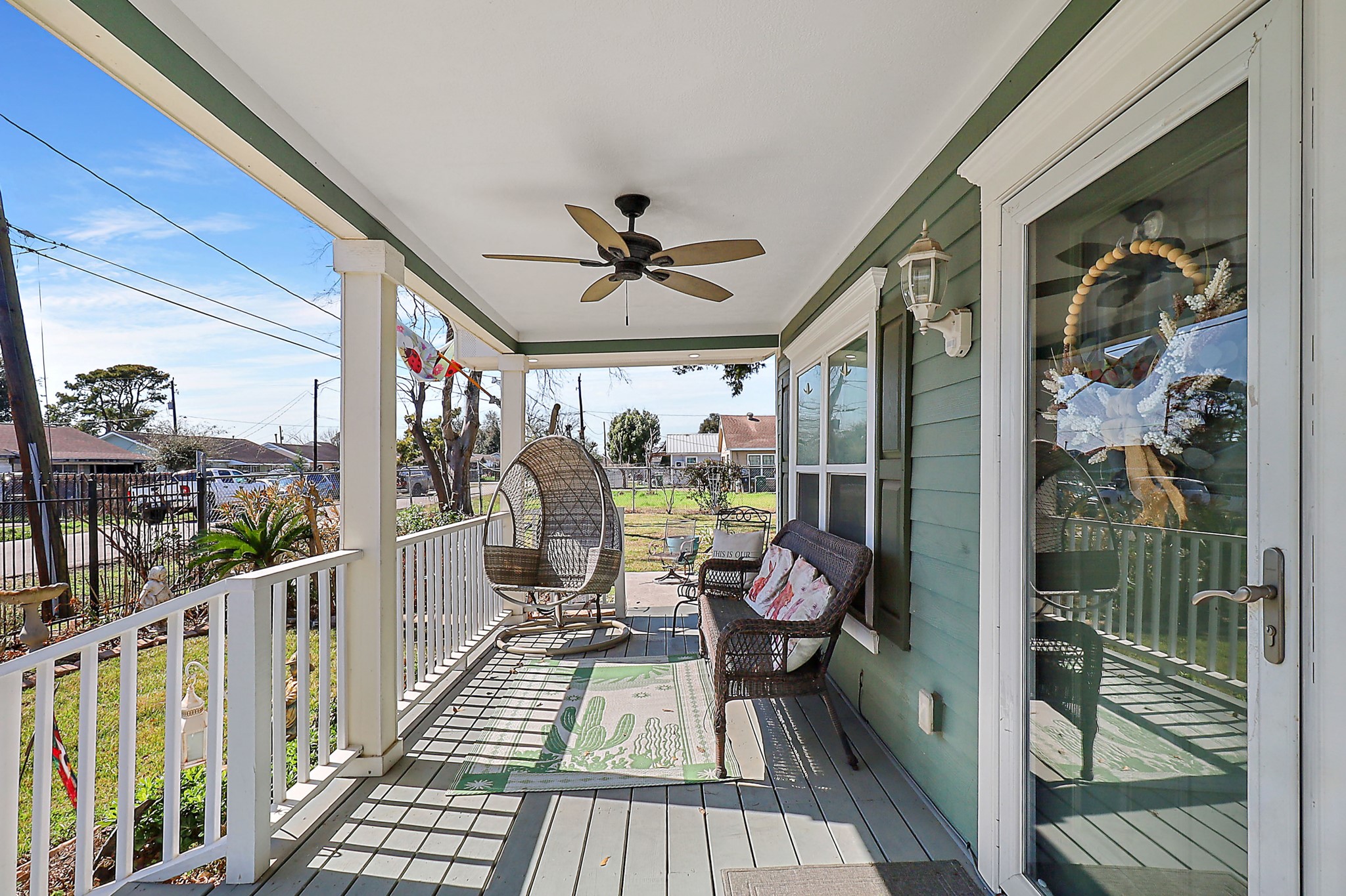 7317 Longview Street Houston, TX 77020 - Photo 3 of 30 a view of a balcony with chairs and wooden floor