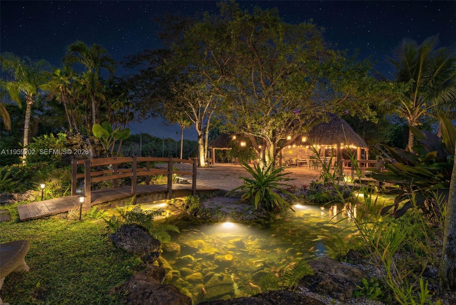 19820 Southwest 244th Street Homestead, FL 33031 - Photo 12 of 52 AN EVENING VIEW OF THE TIKI PAVILLION