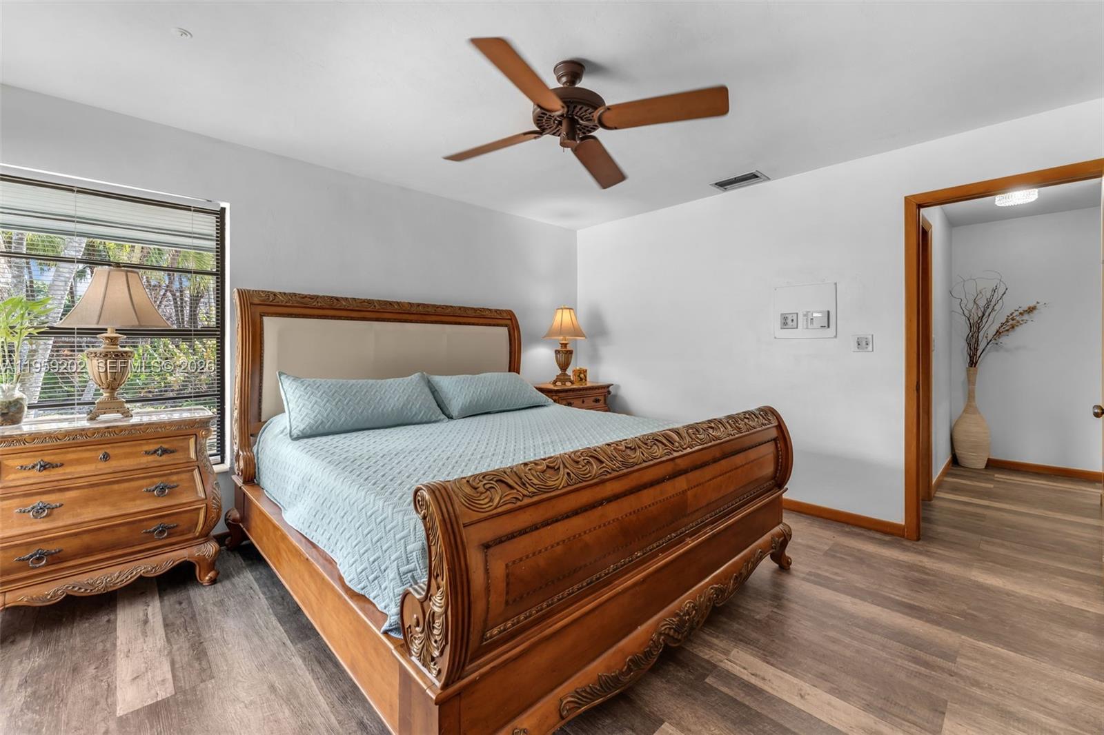 19820 Southwest 244th Street Homestead, FL 33031 - Photo 25 of 52 PRIMARY BEDROOM W/ NEW MODERN WOOD FLOORS, OPEN & AIRY FEELING