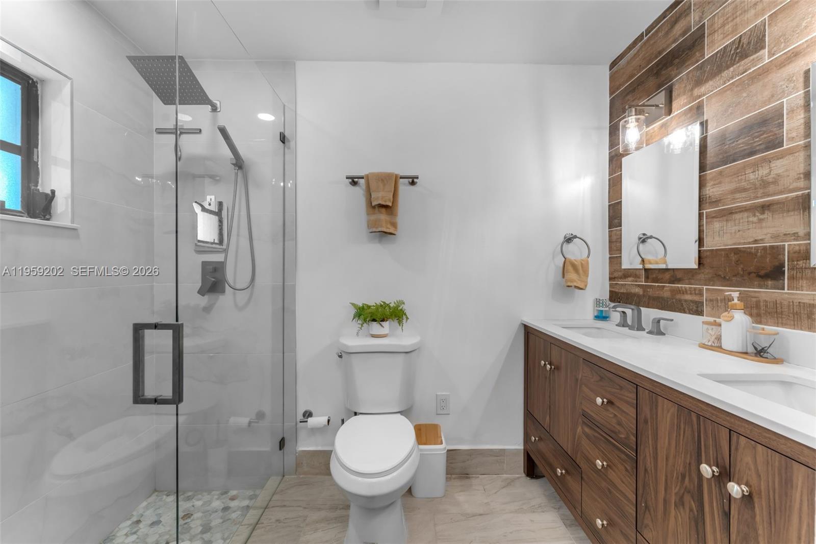 19820 Southwest 244th Street Homestead, FL 33031 - Photo 26 of 52 MODERN & FULLY UPDATED PRIMARY BATH W/ DUAL SINKS.