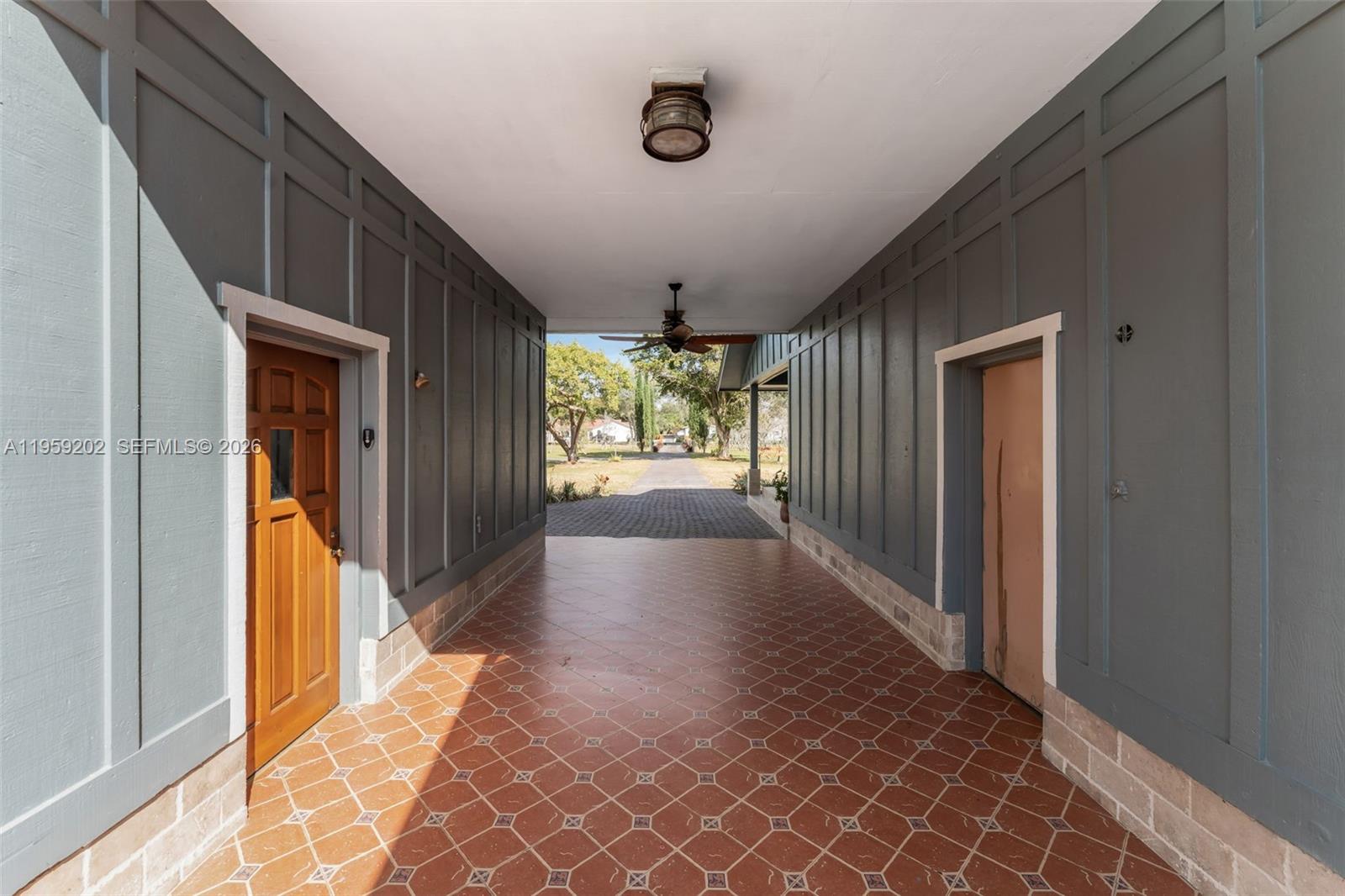 19820 Southwest 244th Street Homestead, FL 33031 - Photo 29 of 52 BREEZEWAY SEPERATING MAIN HOUSE N STUDIO