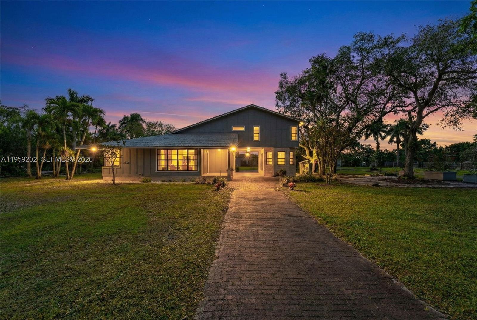 19820 Southwest 244th Street Homestead, FL 33031 - Photo 5 of 52 TWILIGHT PHOTOGRAPHY FRPONT OF THE FARMHOUSE.