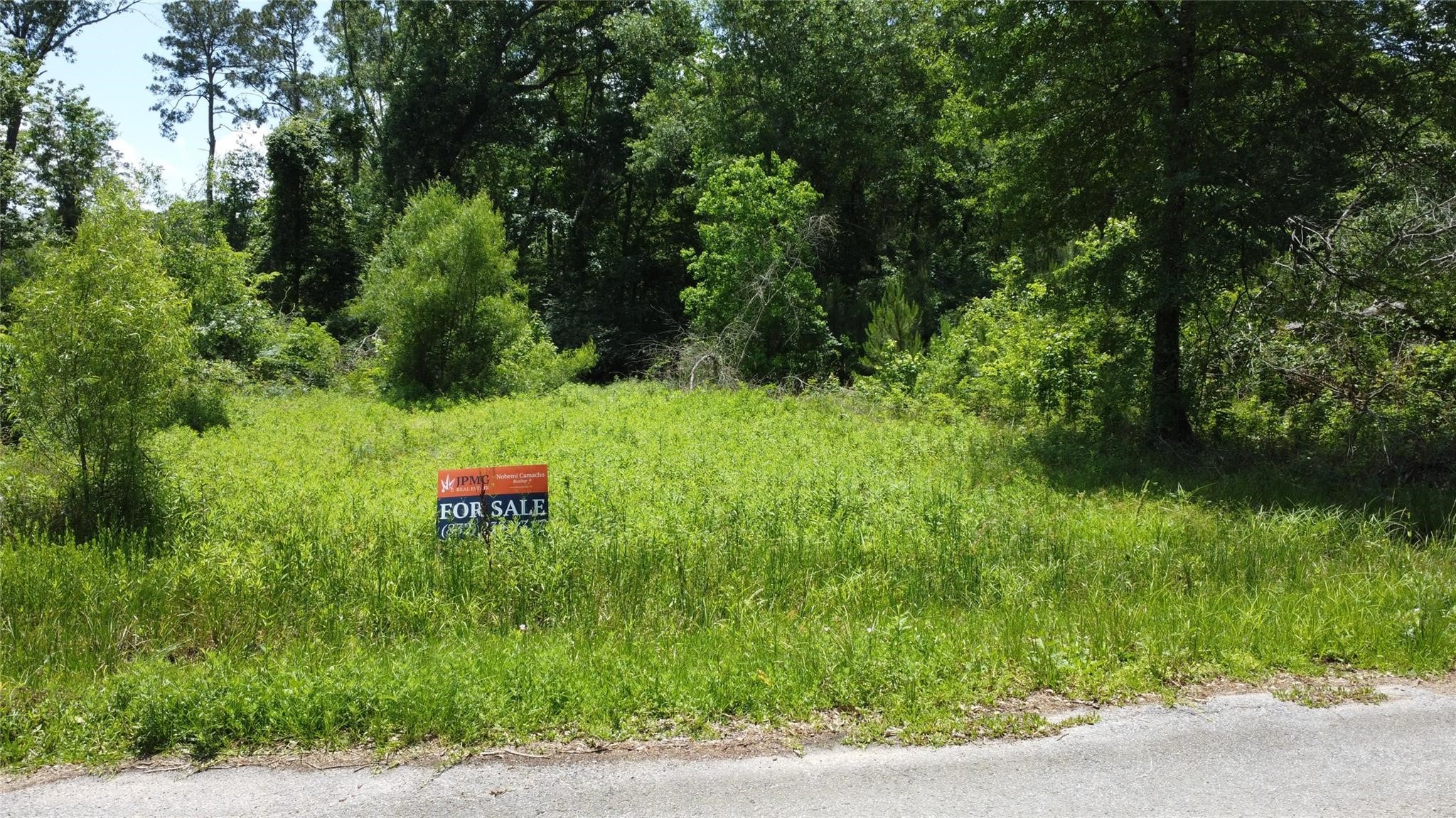 0 Seven X Splendora, TX 77372 - Photo 1 of 3 a backyard of a house with a table and chairs