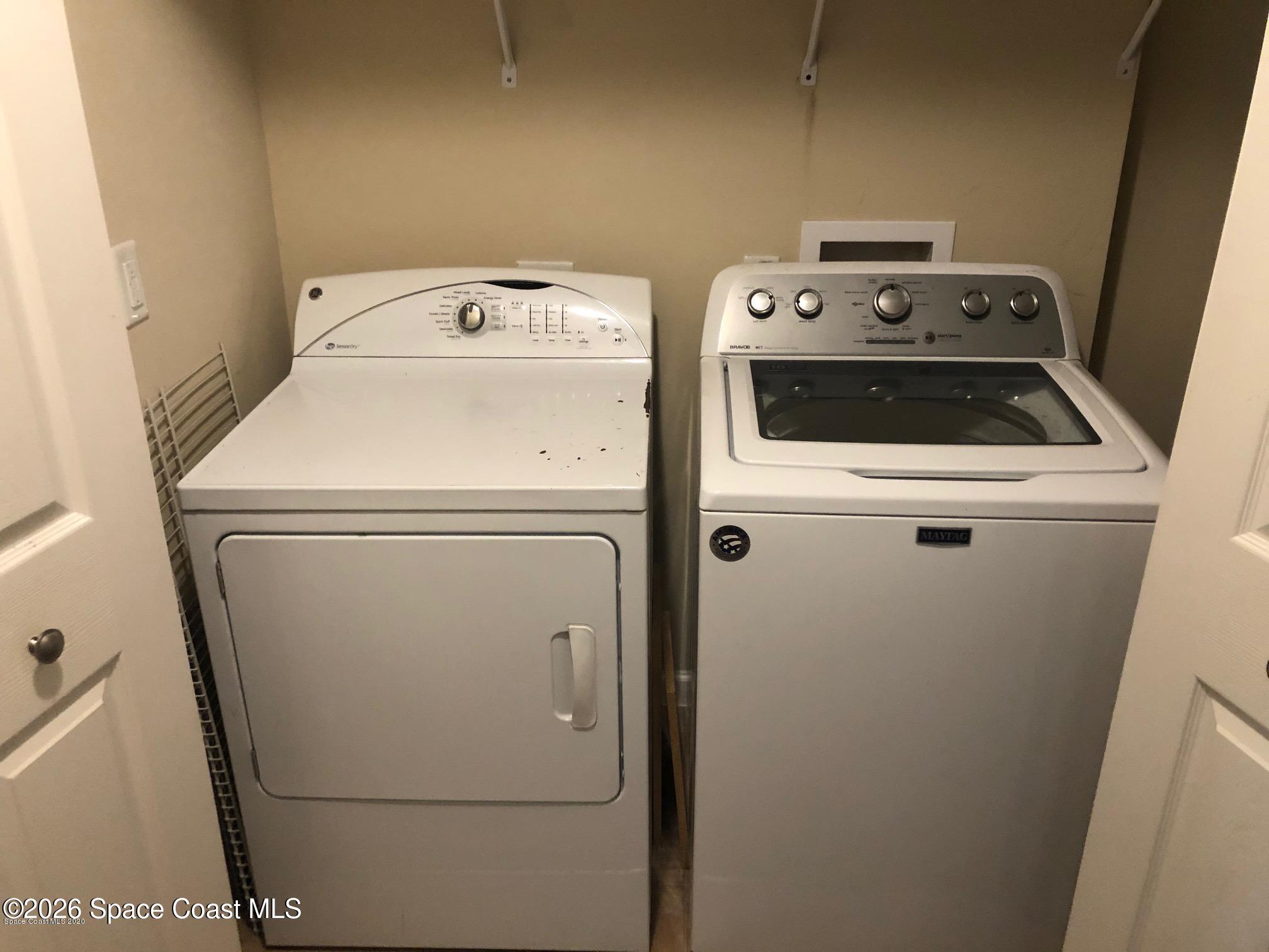1280 Luminary Circle, Unit 103 Melbourne, FL 32901 - Photo 13 of 14 a utility room with dryer and washer