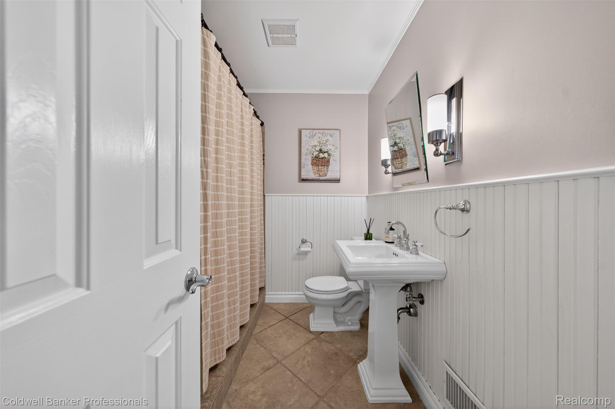 2666 Windemere Road Birmingham, MI 48009 - Photo 10 of 24 Pedestal sink with chrome fixtures, set against beadboard wainscoting and light-toned walls
