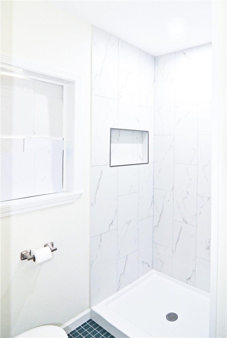 202 Ranch Road Mathis, TX 78368 - Photo 24 of 36 a bathroom with a shower