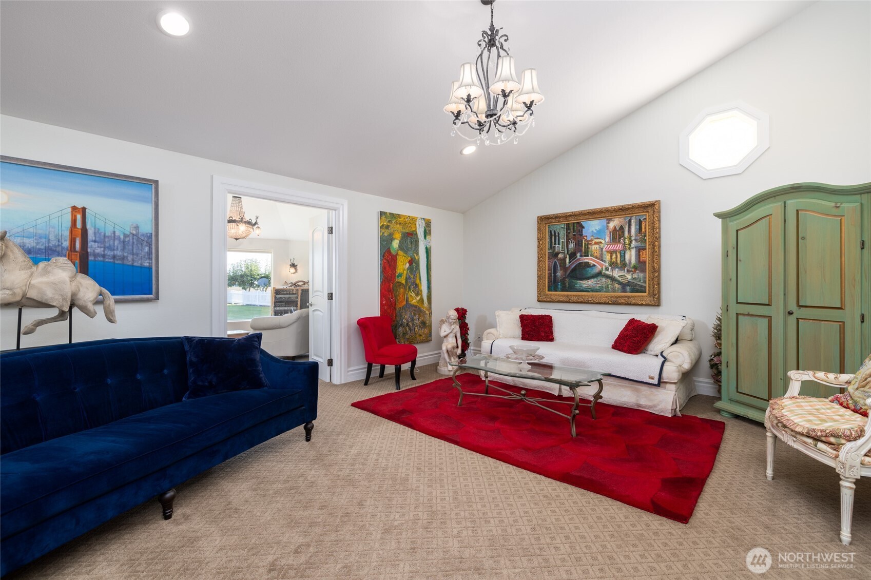 733 Maple Avenue La Conner, WA 98257 - Photo 12 of 39 a living room with furniture and a chandelier