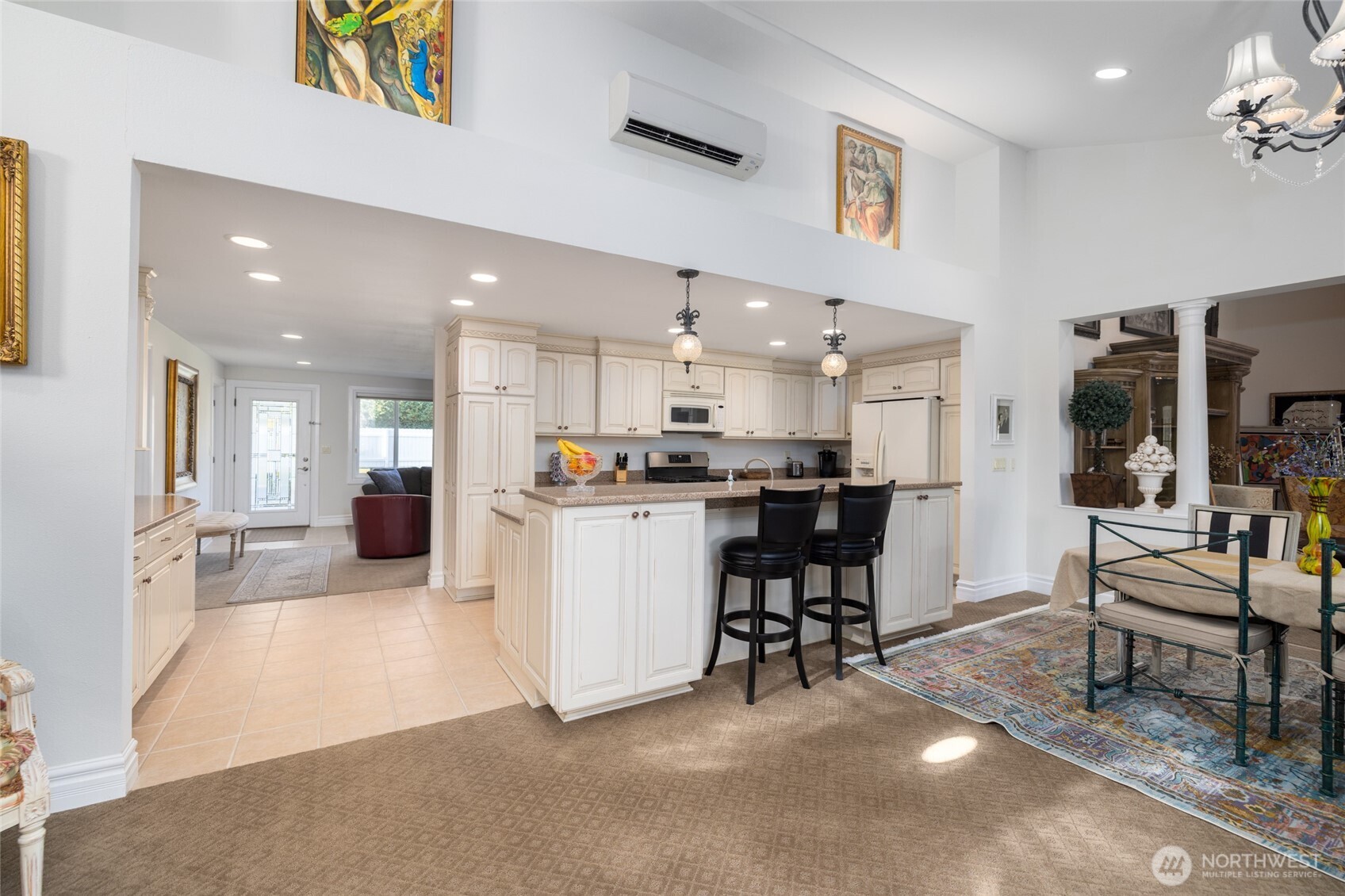 733 Maple Avenue La Conner, WA 98257 - Photo 14 of 39 a view of kitchen with kitchen island stainless steel appliances refrigerator stove dining table and chairs