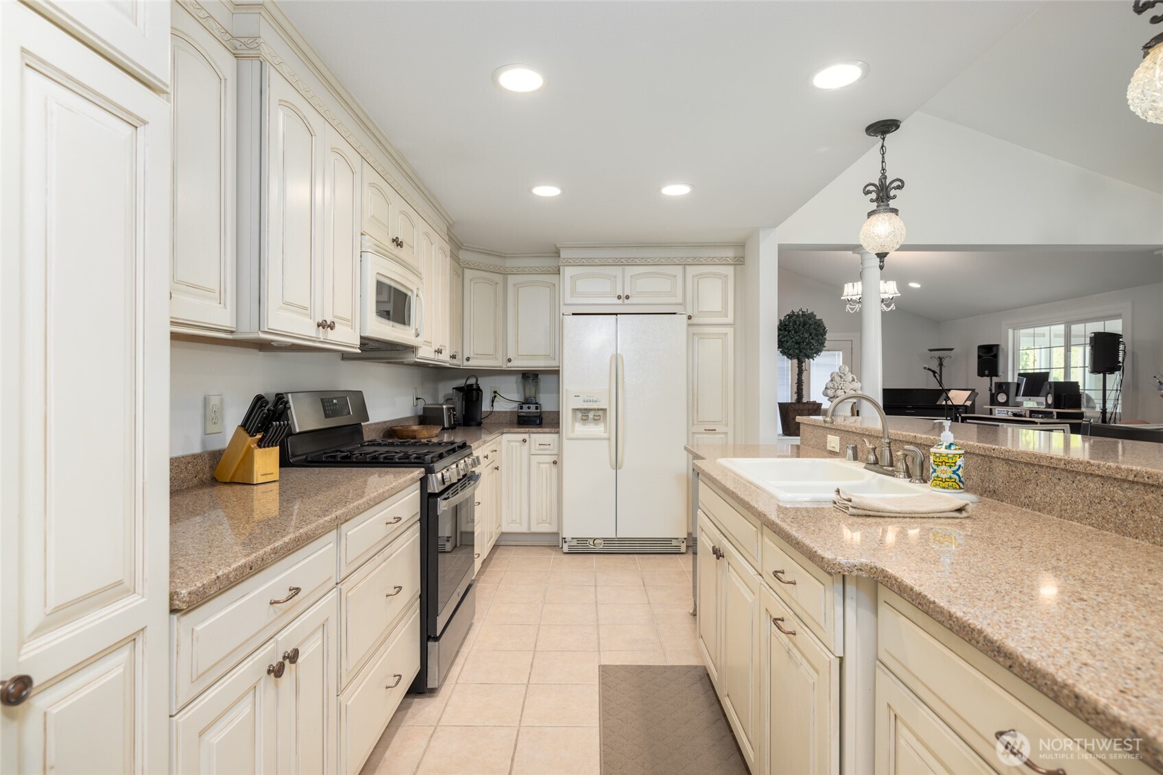 733 Maple Avenue La Conner, WA 98257 - Photo 16 of 39 a kitchen with stainless steel appliances granite countertop a sink and cabinets