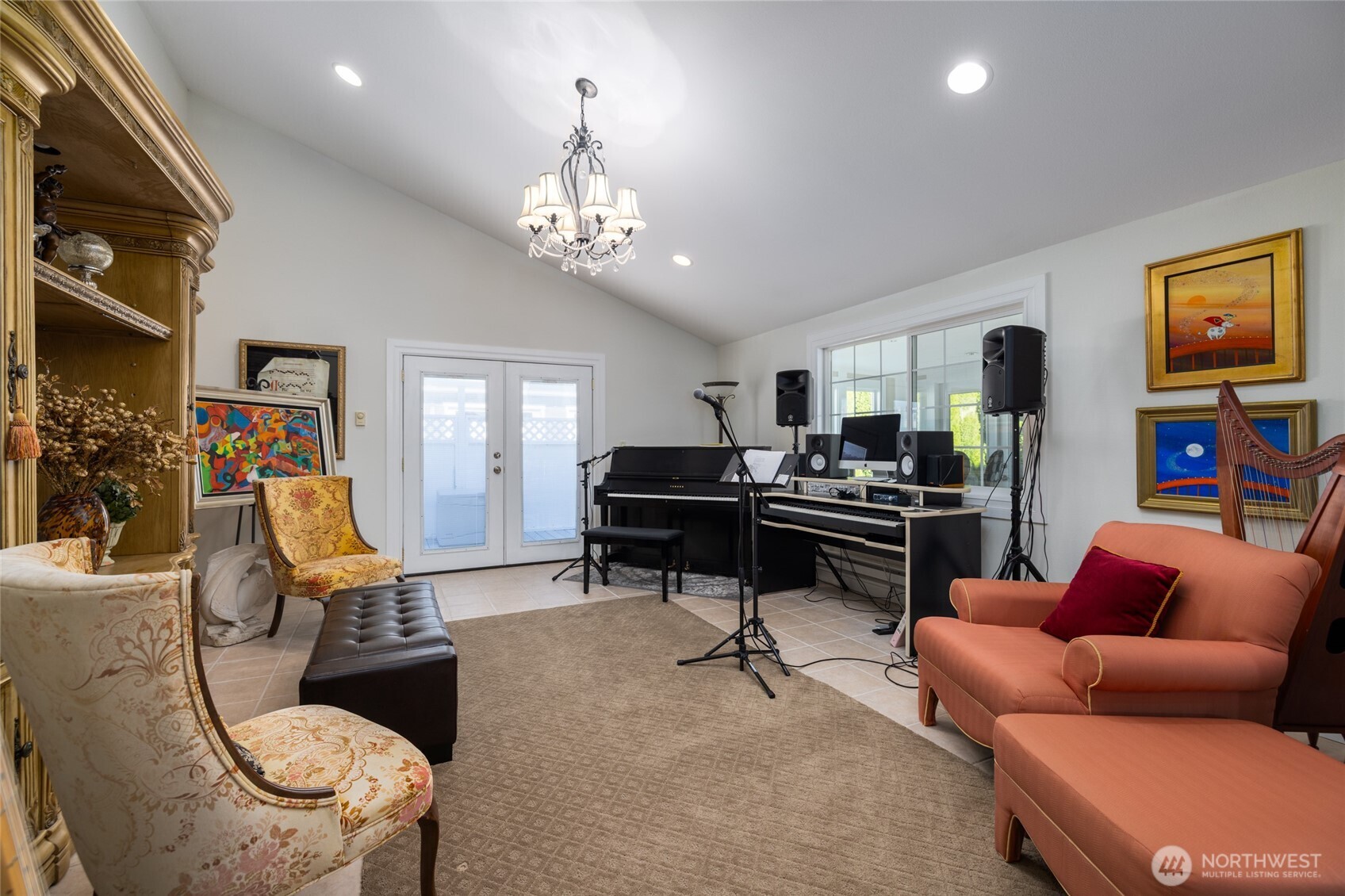 733 Maple Avenue La Conner, WA 98257 - Photo 19 of 39 a living room with furniture a piano and a flat screen tv