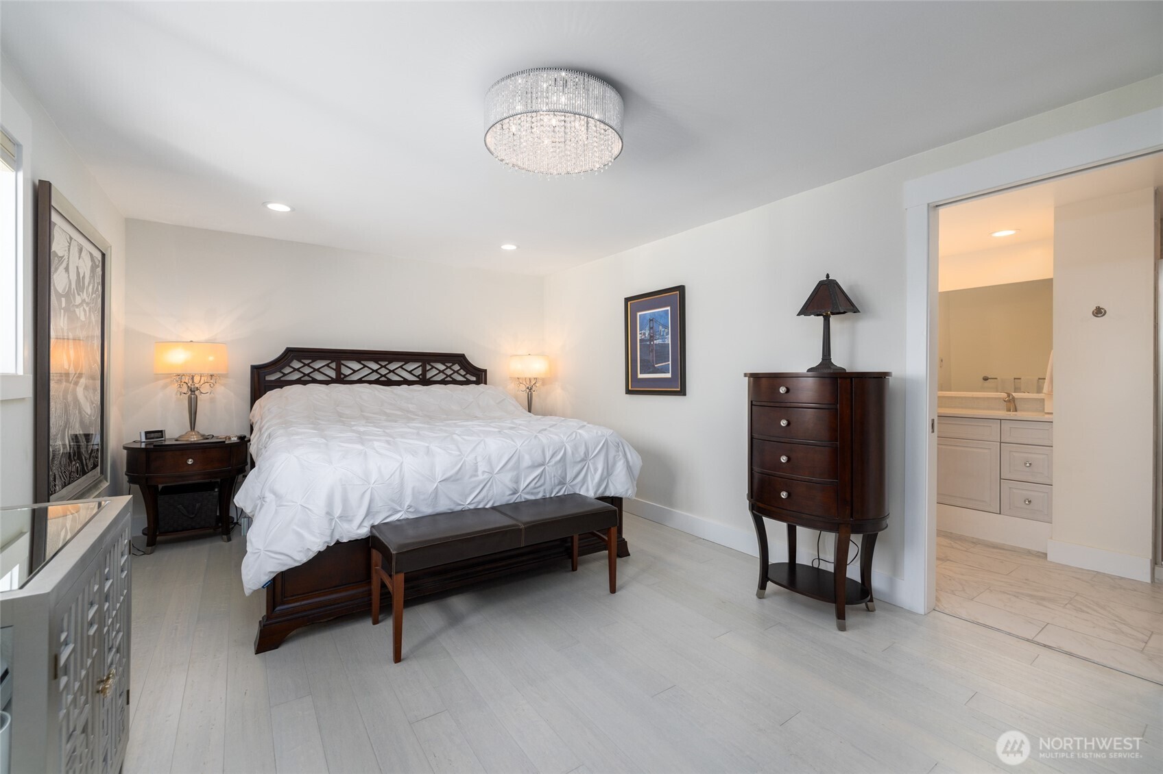733 Maple Avenue La Conner, WA 98257 - Photo 22 of 39 a bedroom with a bed and a chandelier