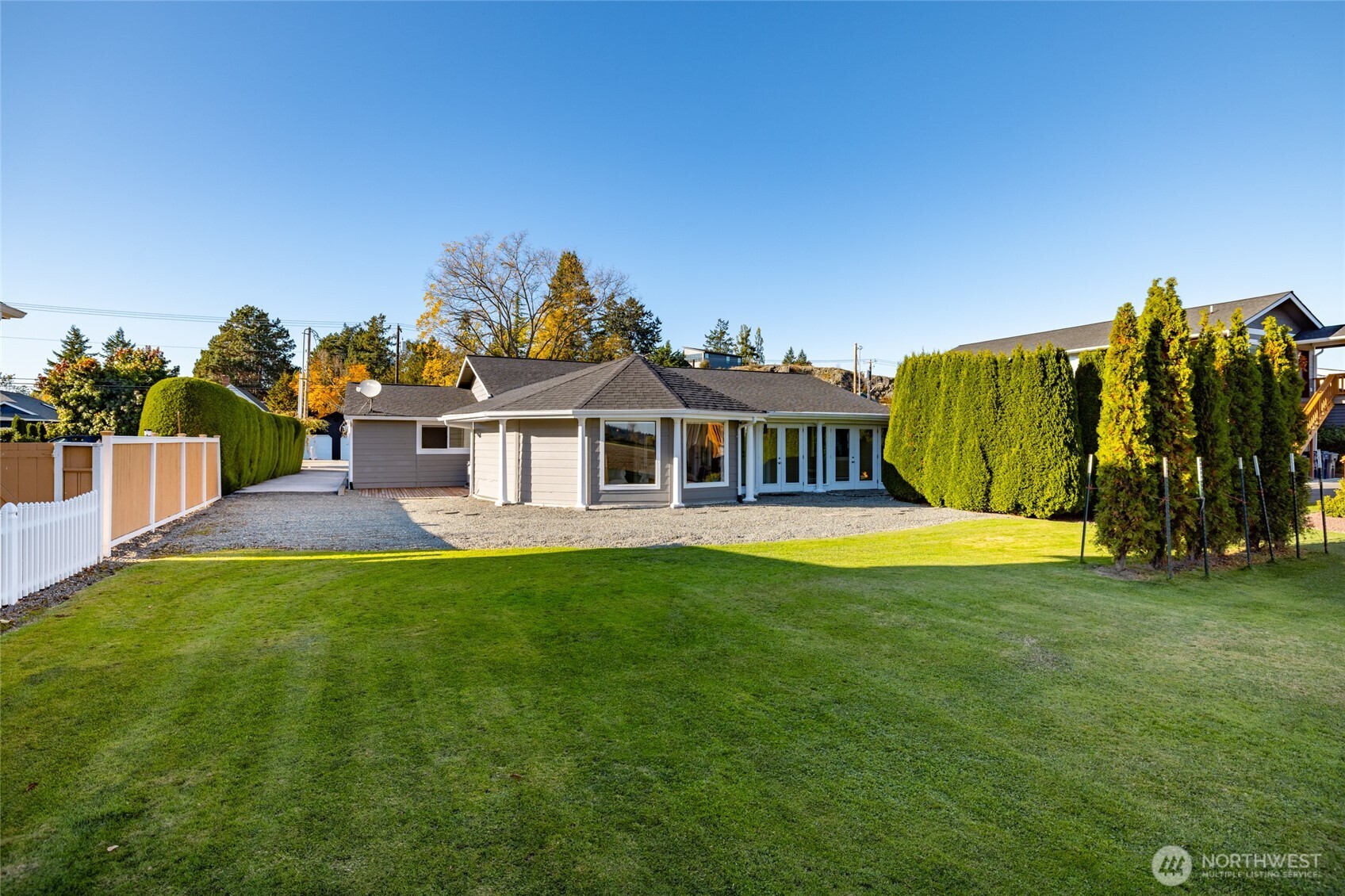 733 Maple Avenue La Conner, WA 98257 - Photo 32 of 39 a view of a house with backyard and a garden