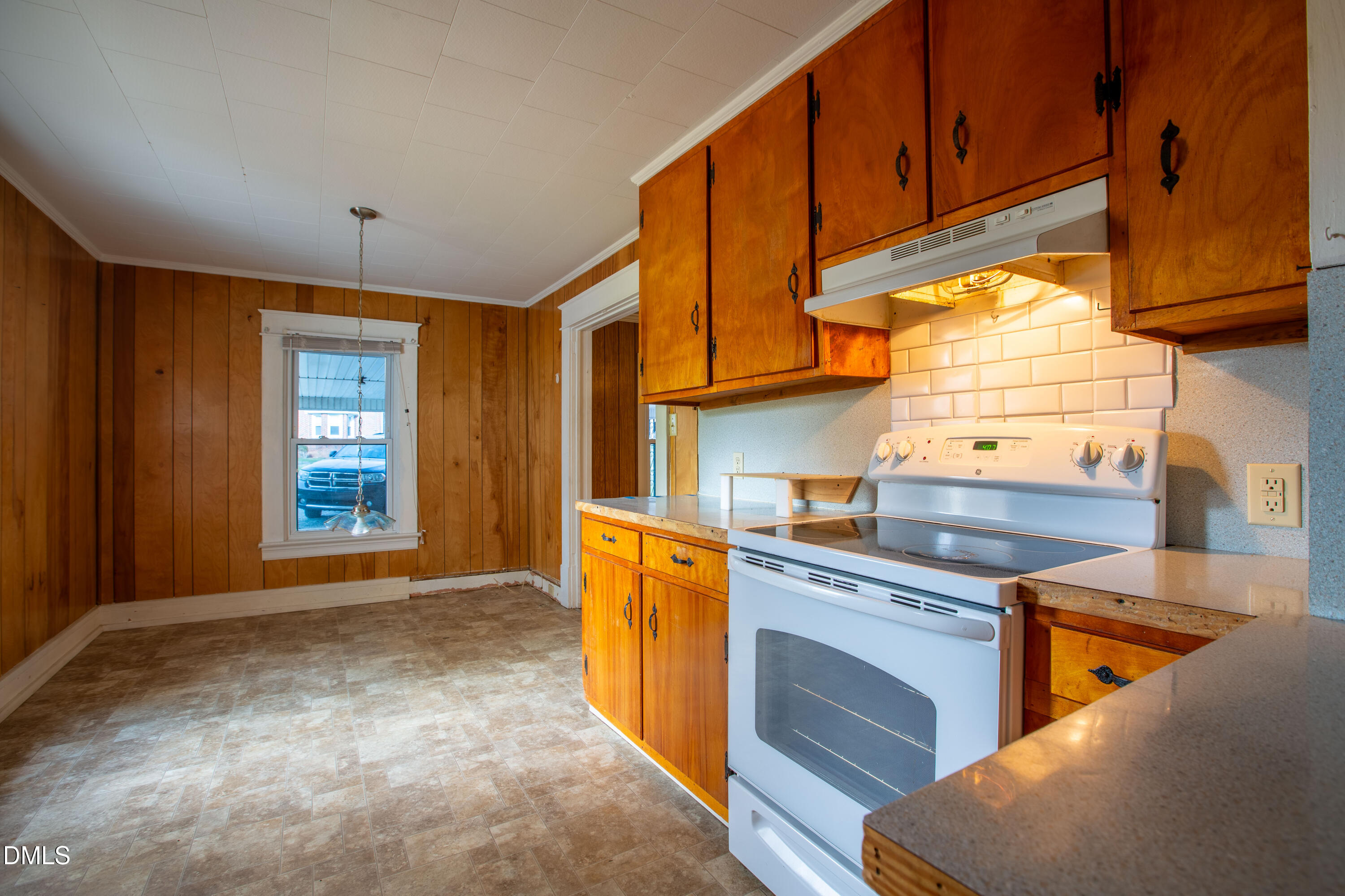 4295 Virgilina Road Roxboro, NC 27574 - Photo 13 of 46 a kitchen with stainless steel appliances granite countertop a sink and cabinets