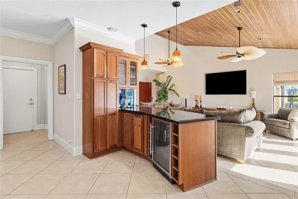 a kitchen with stainless steel appliances granite countertop a sink and a refrigerator