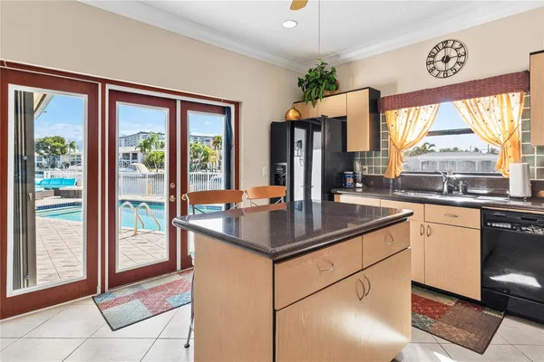 a kitchen with granite countertop a sink and a window
