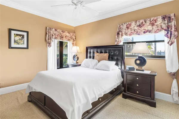 a bed room with a bed and a chandelier