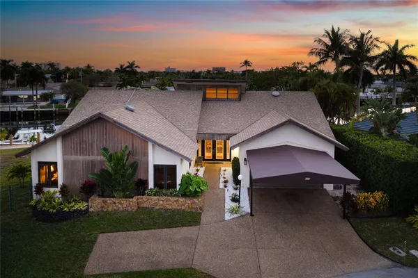 a aerial view of a house with a yard and a garage