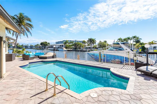 a view of a swimming pool with a lounge chairs