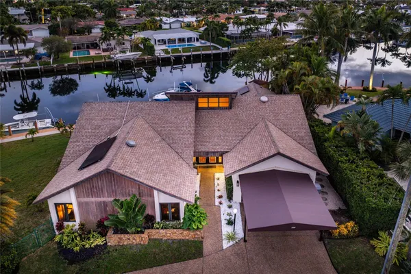 an aerial view of a house with a garden