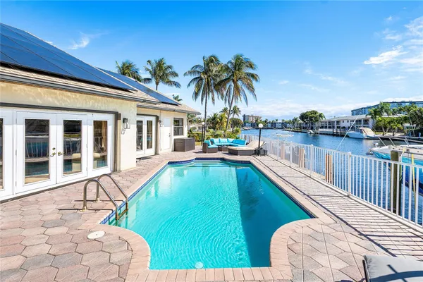 a view of a swimming pool with a lounge chair