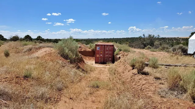 a view of a dry yard covered with snow