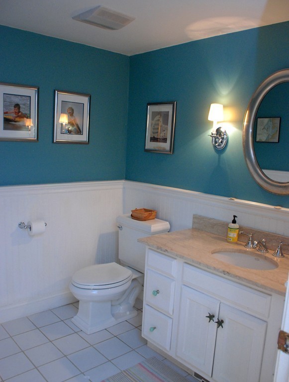 76 Stagecoach Road Duxbury, MA 02332 - Photo 17 of 26 a bathroom with a toilet a sink and mirror