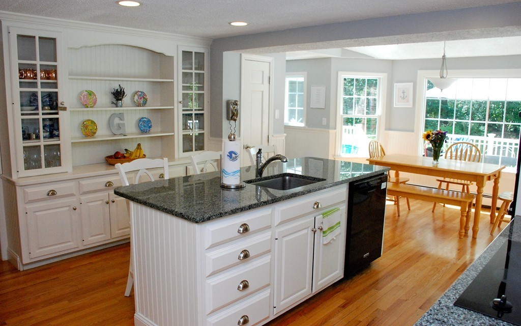 76 Stagecoach Road Duxbury, MA 02332 - Photo 4 of 26 a kitchen with granite countertop a sink and a stove with wooden floor