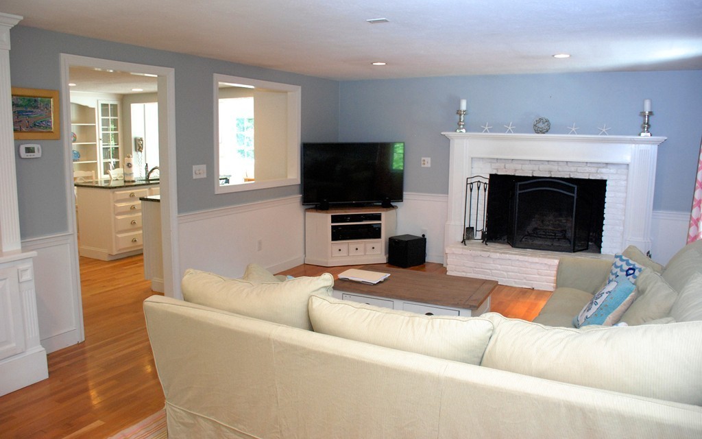 76 Stagecoach Road Duxbury, MA 02332 - Photo 8 of 26 a living room with furniture a flat screen tv and a fireplace