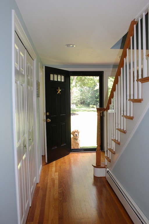 76 Stagecoach Road Duxbury, MA 02332 - Photo 9 of 26 a view of an entryway with wooden floor and door