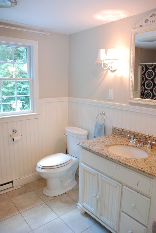 76 Stagecoach Road Duxbury, MA 02332 - Photo 10 of 26 a bathroom with a granite countertop toilet a sink and a window