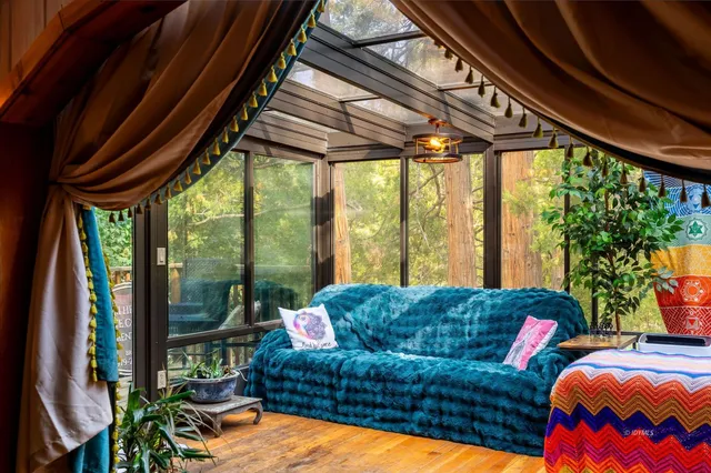 a bathroom with a granite countertop sink and a window