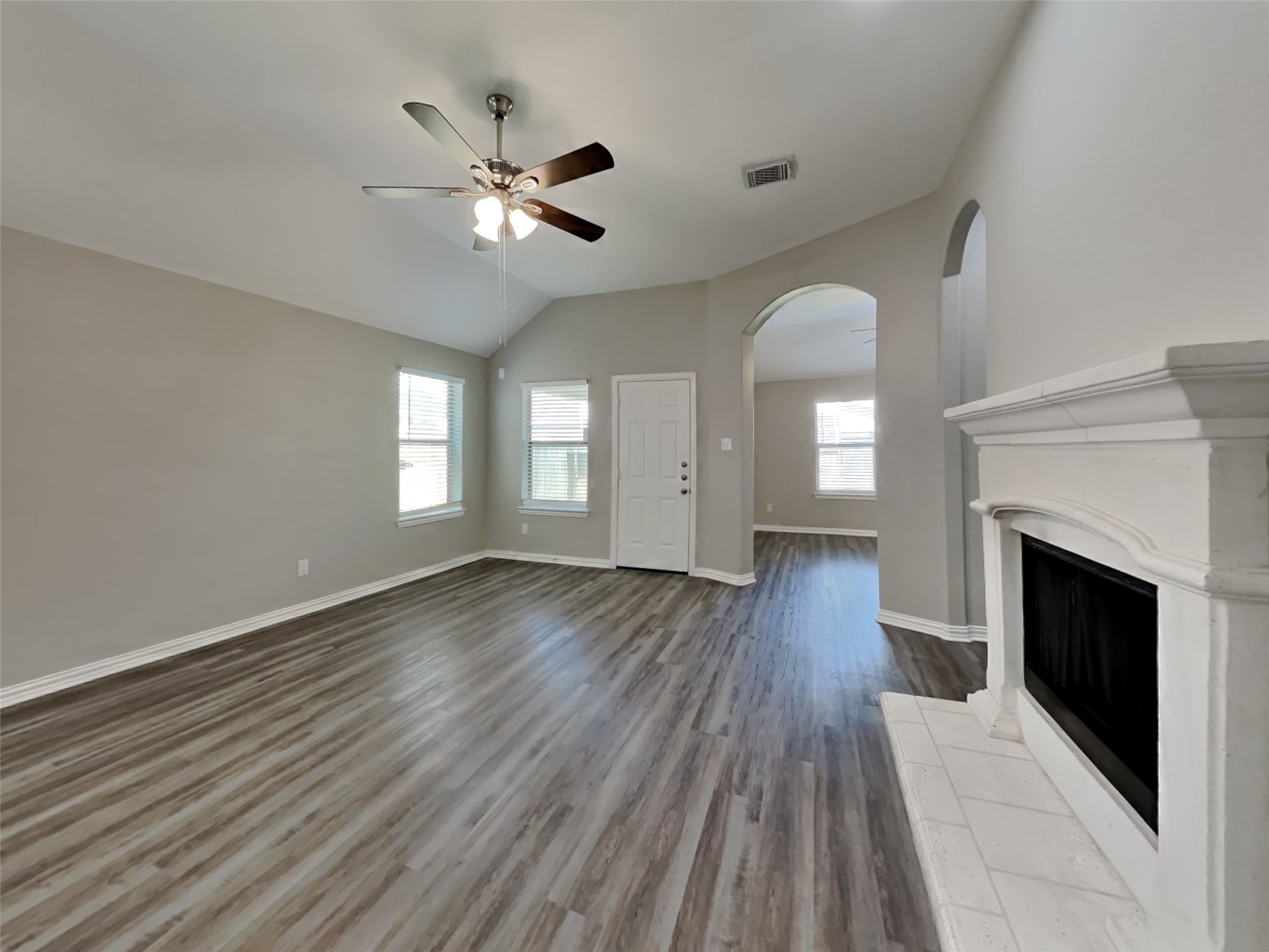 3007 Lockeridge Village Drive Spring, TX 77386 - Photo 3 of 18 a view of empty room with wooden floor fan and window