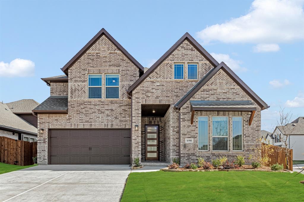 16900 Tussock Avenue Justin, TX 76247 - Photo 1 of 1 a front view of a house with garden