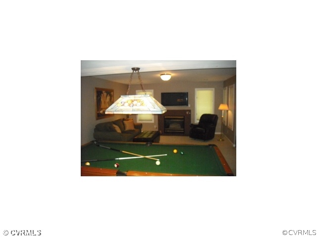 5806 Spinnaker Cove Road Midlothian, VA 23112 - Photo 11 of 12 Entertainment Room - Basement Rec Room with Gas Fireplace and Waterviews