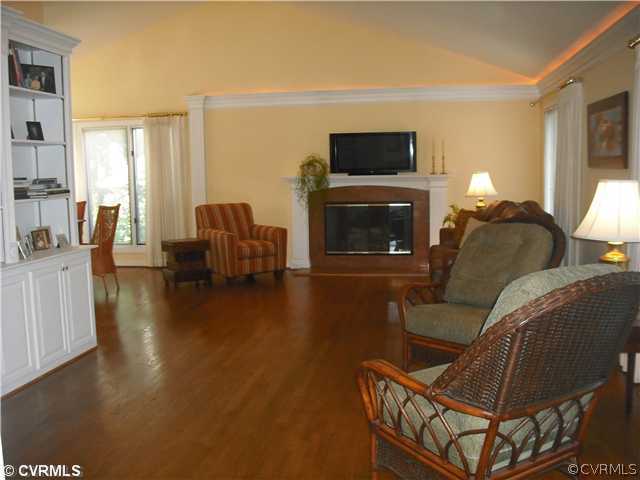 5806 Spinnaker Cove Road Midlothian, VA 23112 - Photo 3 of 12 Den/Family/Great Room - Family Room with Hardwood and built in bookcases with wood burning fireplace(could be converted to gas)