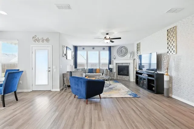 a living room with furniture and a fireplace
