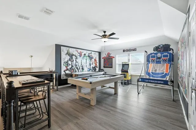 a living room with furniture a rug and a window