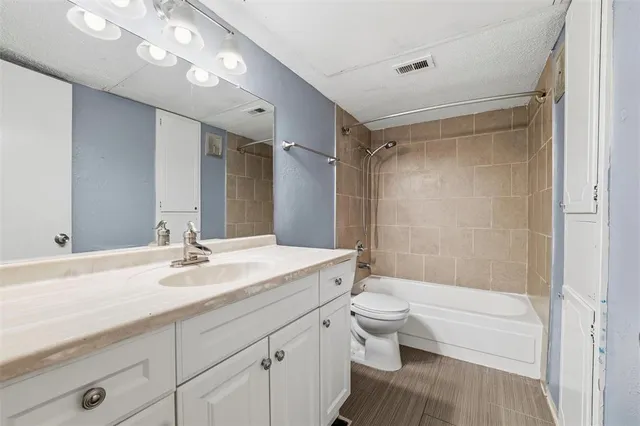 a bathroom with a bathtub and a toilet