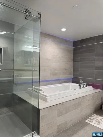 a bathroom with a shower and a sink