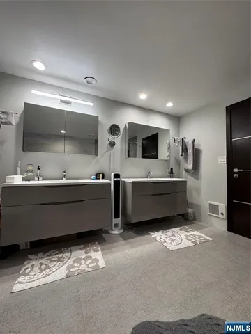 a kitchen with a refrigerator and a sink