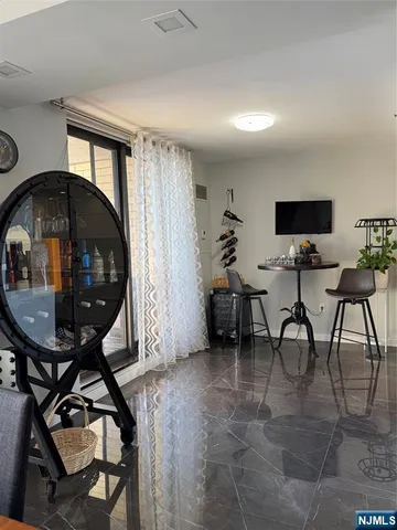 a kitchen with a potted plant on the counter and cabinets