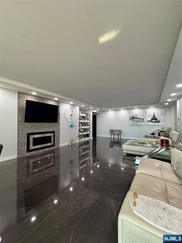 a kitchen with stainless steel appliances granite countertop a sink and a refrigerator