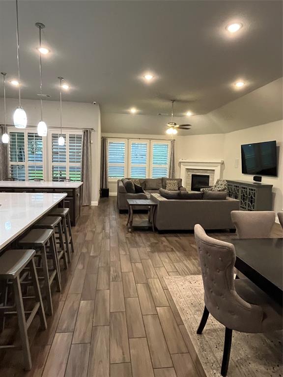 7040 Cross Point Lane Little Elm, TX 76227 - Photo 5 of 16 a living room filled with furniture and a flat screen tv