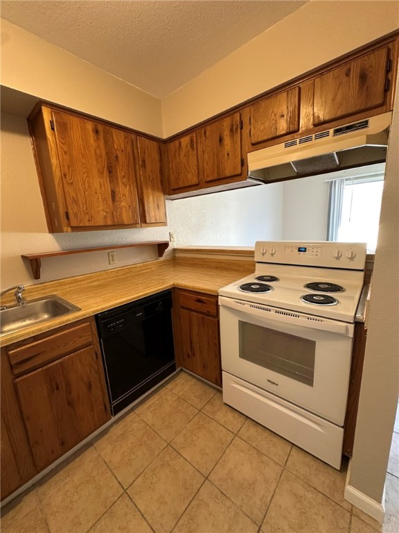 4917 Delwood Street, Unit C3 Corpus Christi, TX 78413 - Photo 11 of 24 a kitchen with a stove and a sink