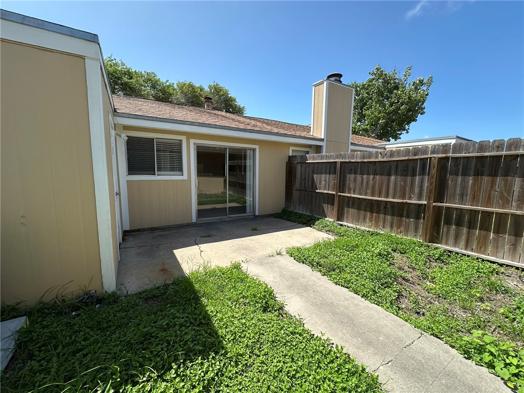 4917 Delwood Street, Unit C3 Corpus Christi, TX 78413 - Photo 22 of 24 a view of a backyard with a garden