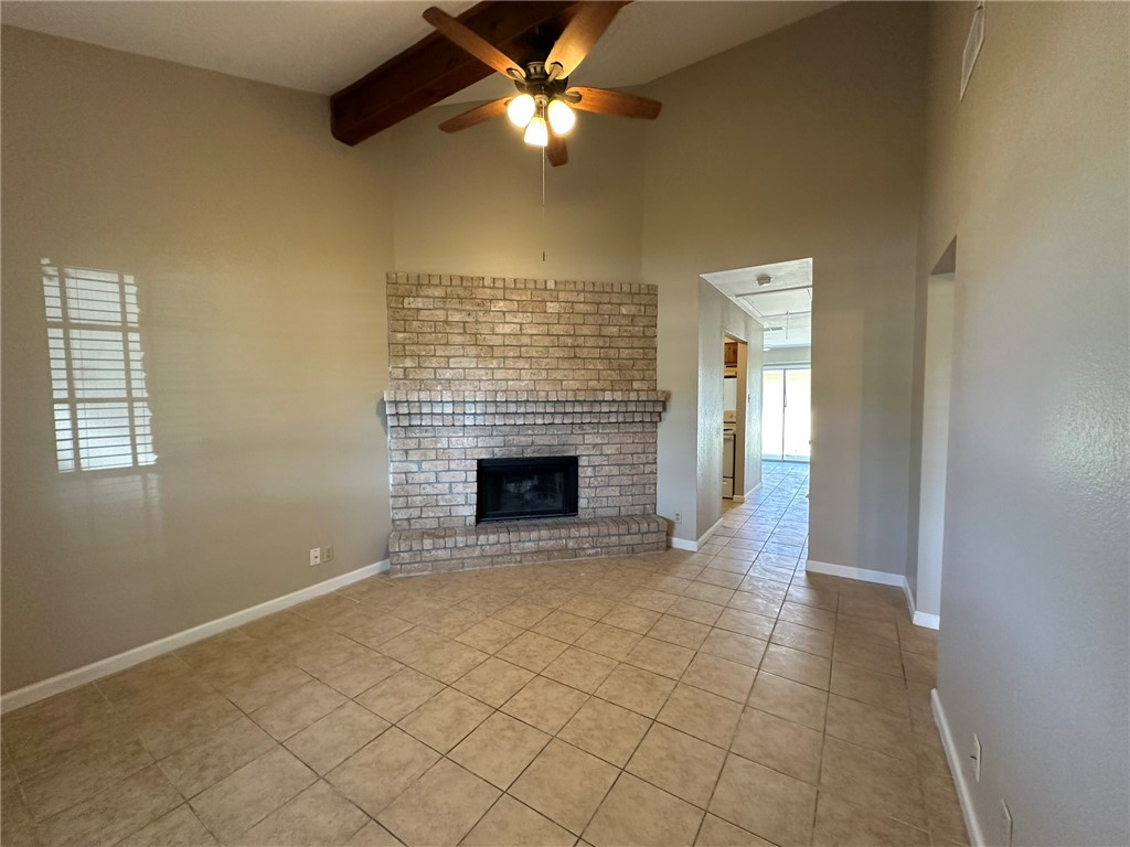 4917 Delwood Street, Unit C3 Corpus Christi, TX 78413 - Photo 3 of 24 a view of an empty room with a fireplace