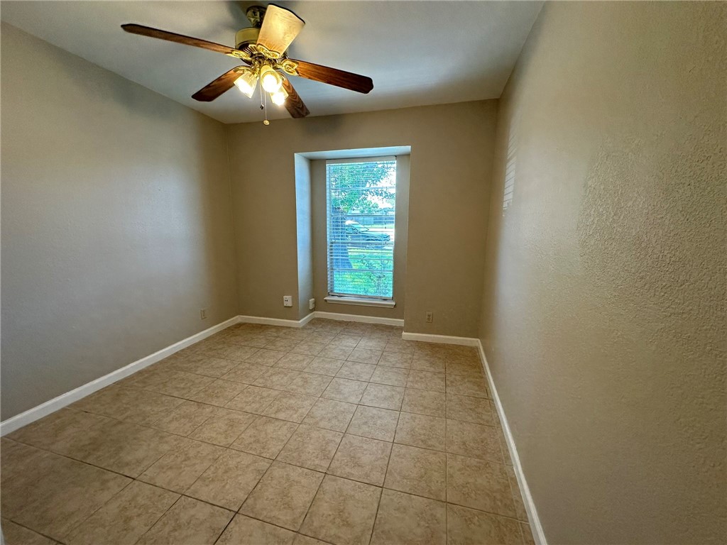 4917 Delwood Street, Unit C3 Corpus Christi, TX 78413 - Photo 5 of 24 a view of an empty room and window chandelier fan