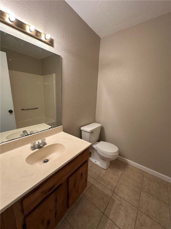 4917 Delwood Street, Unit C3 Corpus Christi, TX 78413 - Photo 7 of 24 a bathroom with a sink a toilet and mirror